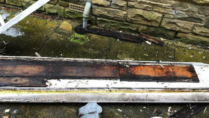 A Rotten Fascia Board that had been capped on a house in Denby Dale Wakefield West Yorkshire